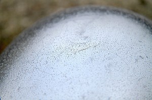 A circular 'impact' mark is faintly visible.
